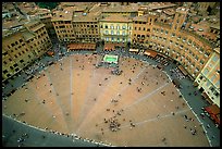 Medieval Piazza Del Campo with paving divided into nine sectors to represent Council of Nine.. Siena, Tuscany, Italy (color)