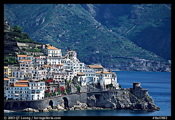Houses built on a rocky promontory in Amalfi. Amalfi Coast, Campania, Italy