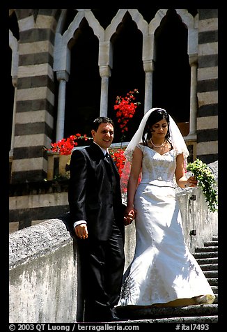 Newly wed couple on the stairs of Duomo Sant'Andrea, Amalfi. Amalfi Coast, Campania, Italy