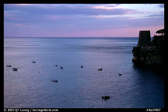 Small boats and tower and sunset, Positano. Amalfi Coast, Campania, Italy (color)