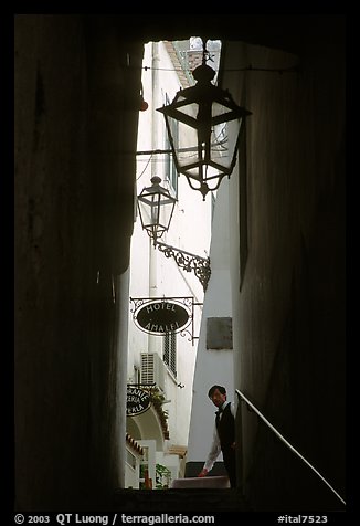 Narrow stairway with formally dressed man and hotel sign,  Amalfi. Amalfi Coast, Campania, Italy