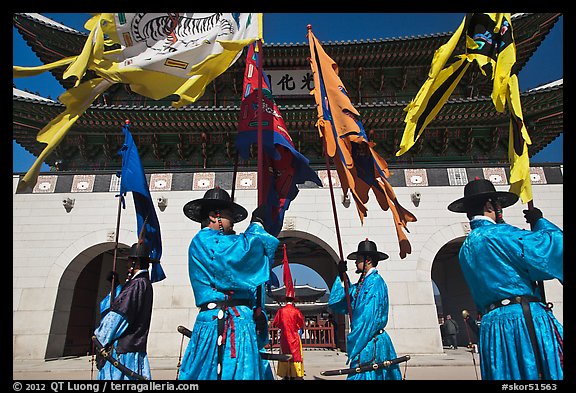 Guards carrying flags in front of main gate, Gyeongbokgung. Seoul, South Korea