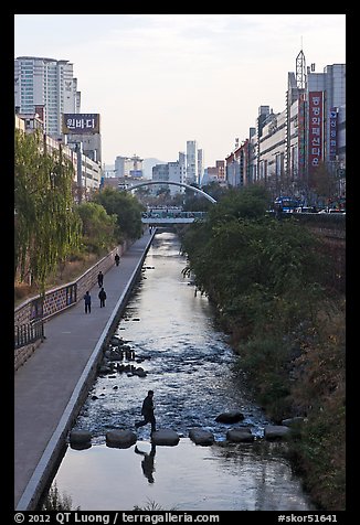 Man crossing Cheonggye stream. Seoul, South Korea