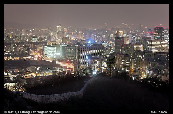 Old fortress wall and city skyline at night. Seoul, South Korea (color)
