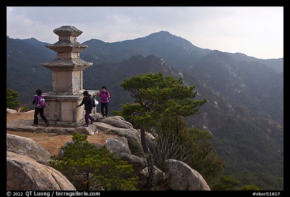 Women circling stone pagoda, Mt Namsan. Gyeongju, South Korea