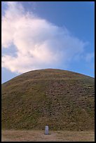 Mound of earth raised over grave and cloud. Gyeongju, South Korea (color)