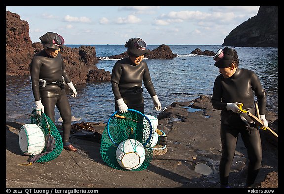 Elderly Haeneyo women in wetsuits. Jeju Island, South Korea (color)