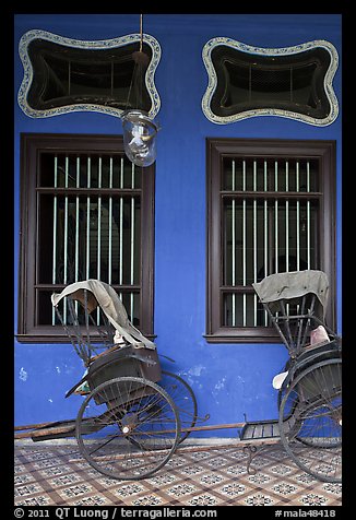 Rickshaws and windows, Cheong Fatt Tze Mansion. George Town, Penang, Malaysia (color)