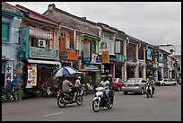 Chinatown street with traffic and storehouses. George Town, Penang, Malaysia ( color)
