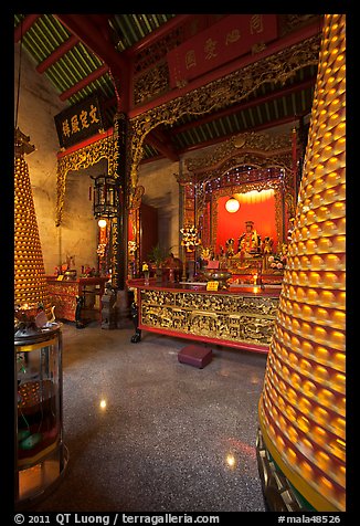 Altar and wheels in motion, Hainan Temple. George Town, Penang, Malaysia