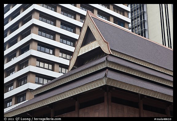 Roof of traditional tek house and modern buildings. Kuala Lumpur, Malaysia (color)