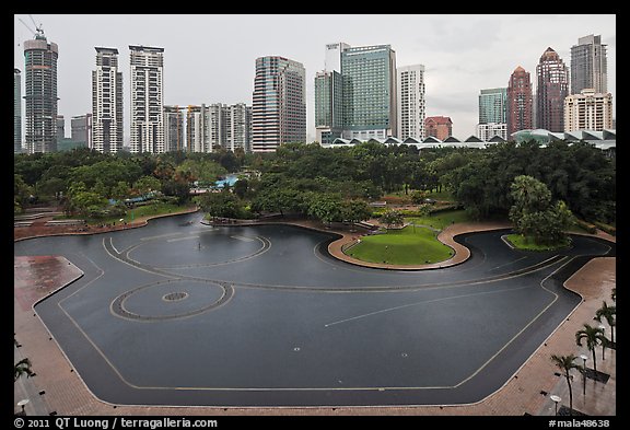 KLCC Park surrounded by high-rise towers. Kuala Lumpur, Malaysia (color)