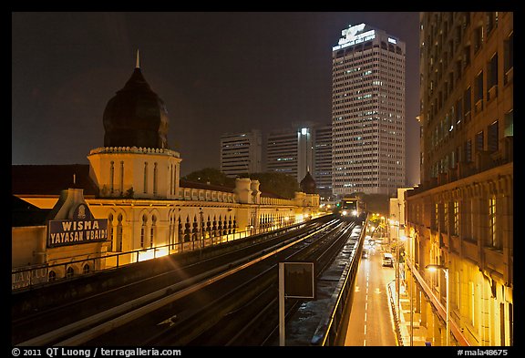 LRT train and tracks in front of Panggung Bandaraya at night. Kuala Lumpur, Malaysia