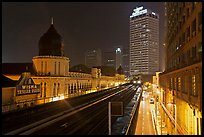 LRT train and tracks in front of Panggung Bandaraya at night. Kuala Lumpur, Malaysia