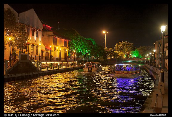 Tour boats on Melaka River at night. Malacca City, Malaysia