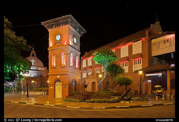 Town Square with Stadthuys, clock tower, and church at night. Malacca City, Malaysia