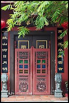 Weathered door with chinese signs and lanterns. Malacca City, Malaysia (color)