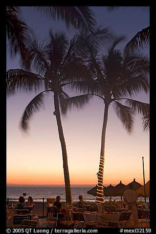 Outdoor restaurant with palm trees at sunset, Nuevo Vallarta, Nayarit. Jalisco, Mexico (color)