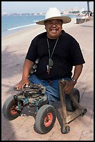 Man without legs  smiling on the Malecon, Puerto Vallarta, Jalisco. Jalisco, Mexico (color)