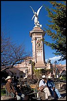 Men wearing cow-boy hats sitting in Garden of Independencia. Zacatecas, Mexico (color)
