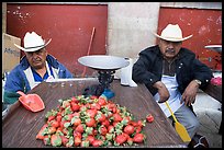 Men with cow-boy hats selling strawberries. Guanajuato, Mexico