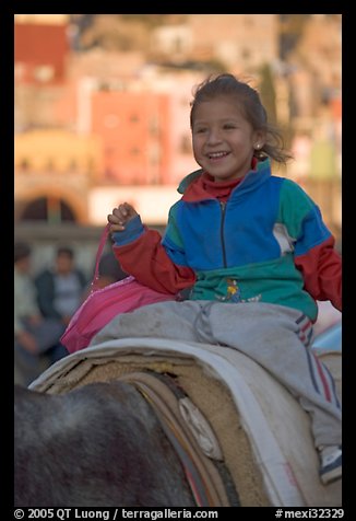 Girl riding a donkey. Guanajuato, Mexico