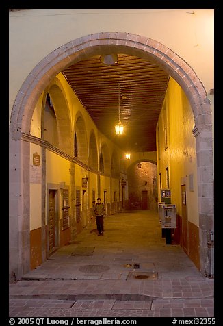 Man walking in an arched passage a dawn. Guanajuato, Mexico (color)