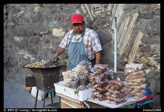 Man selling grilled peanuts on the street. Guanajuato, Mexico (color)