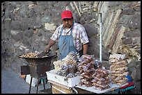 Man selling grilled peanuts on the street. Guanajuato, Mexico (color)