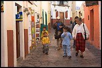 Family walking down an alley. Guanajuato, Mexico