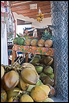 Tropical Fruit stand with girl in background. Mexico