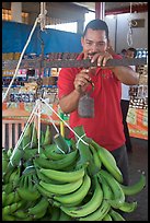 Man weighting bananas. Mexico ( color)