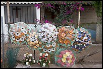 Floral wheels in a cemetery. Mexico