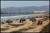 Beach with shade palapas and horseman, Ensenada. Baja California, Mexico (color)