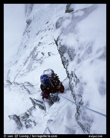 Frank Levy during a storm,  North face of Les Droites,  Mont-Blanc Range, Alps, France.  (color)