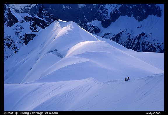 Alpinists on the Aiguille du Midi ridge. Alps, France