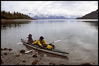 Kayakers land in Hugh Miller Inlet. Glacier Bay National Park, Alaska (color)