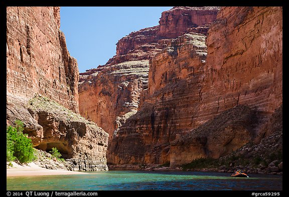 Raft dwarfed by huge Redwall limestone canyon walls. Grand Canyon National Park, Arizona