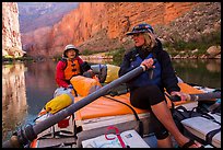 River guide converses with passenger on raft, Marble Canyon. Grand Canyon National Park, Arizona