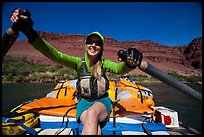 Woman paddling oar-powered raft. Grand Canyon National Park, Arizona