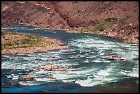 Motor-powered raft navigating Hance Rapids. Grand Canyon National Park, Arizona
