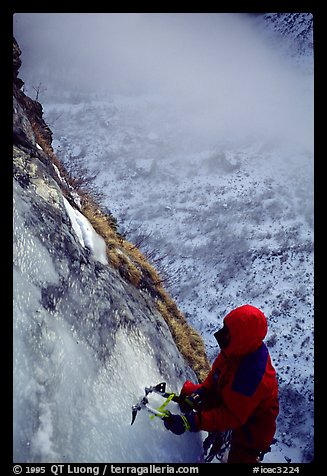 Topping out the stalactite of the Moulins Falls, La Grave. Alps, France (color)
