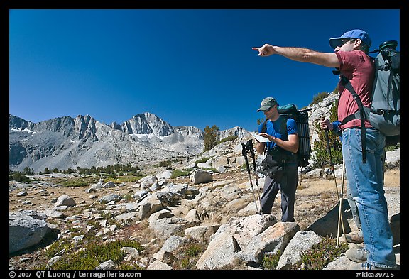 Hikers looking at map and pointing, Dusy Basin. Kings Canyon National Park, California (color)