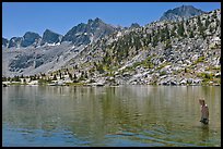 Young man in alpine lake, lower Dusy Basin. Kings Canyon National Park, California (color)