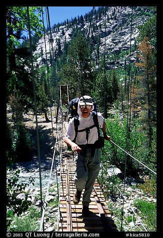 Crossing a river on a suspension bridge. Kings Canyon National Park, California