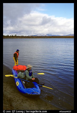 Canoeists ready to lauch with the boat loaded up. Kobuk Valley National Park, Alaska (color)