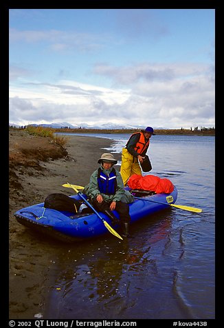 Canoeists finish  loading  with the boat prior to launching. Kobuk Valley National Park, Alaska