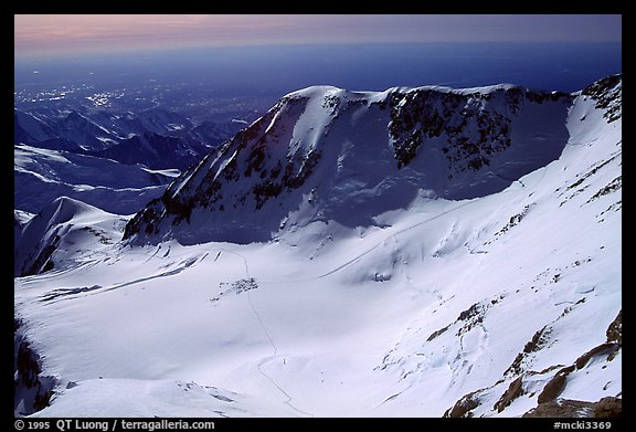The three tracks starting from the 14300 camp are very visible: to Windy Corner, the West Buttress, and the West Rib (although these were only my tracks). The 14300 camp would soon be in the shade. Denali, Alaska (color)