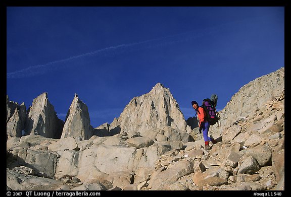 Woman with backpack hiking at the base of Mt Whitney. Sequoia National Park, California
