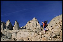 Woman with backpack hiking at the base of Mt Whitney. Sequoia National Park, California (color)